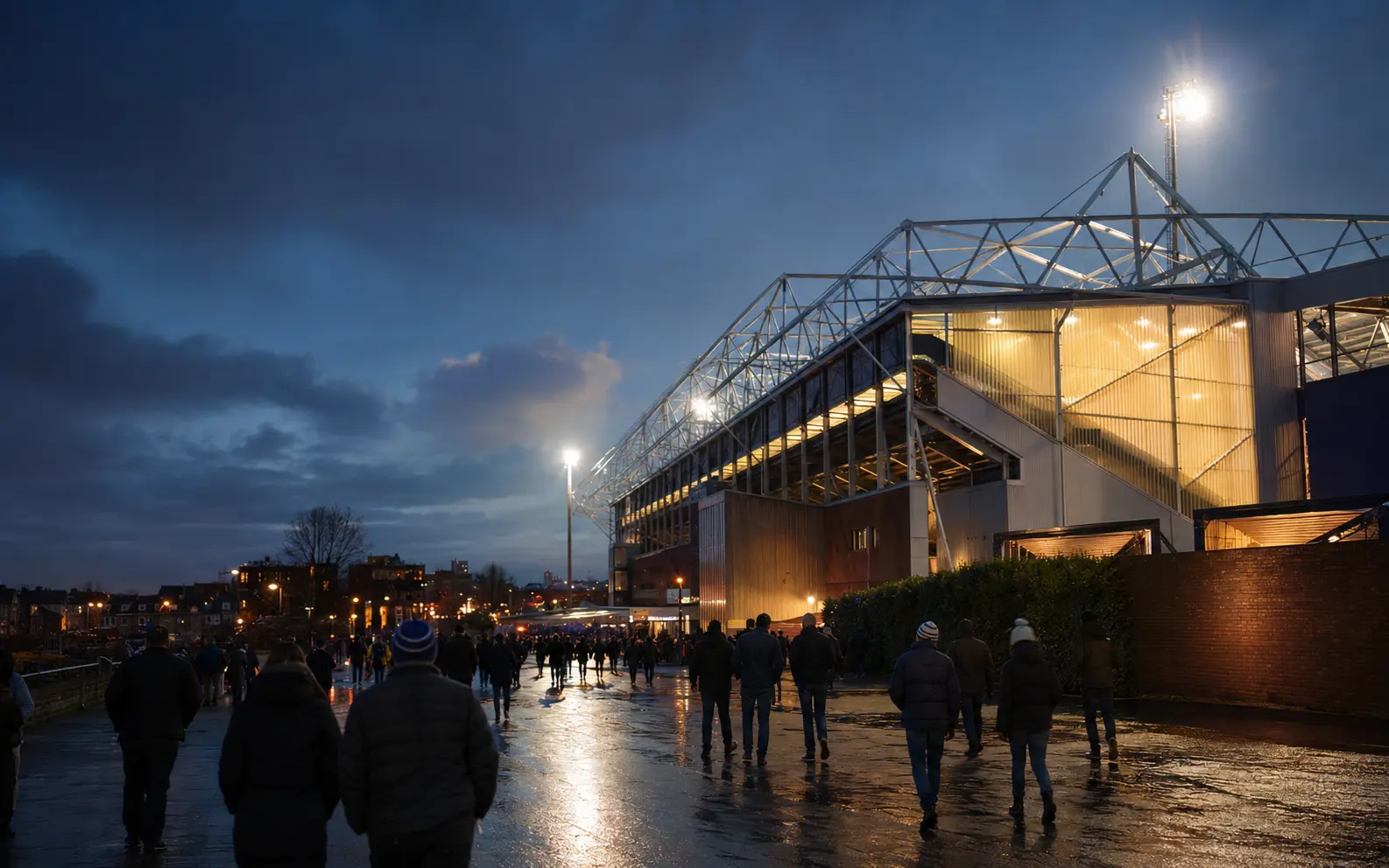 Football stadium under floodlights