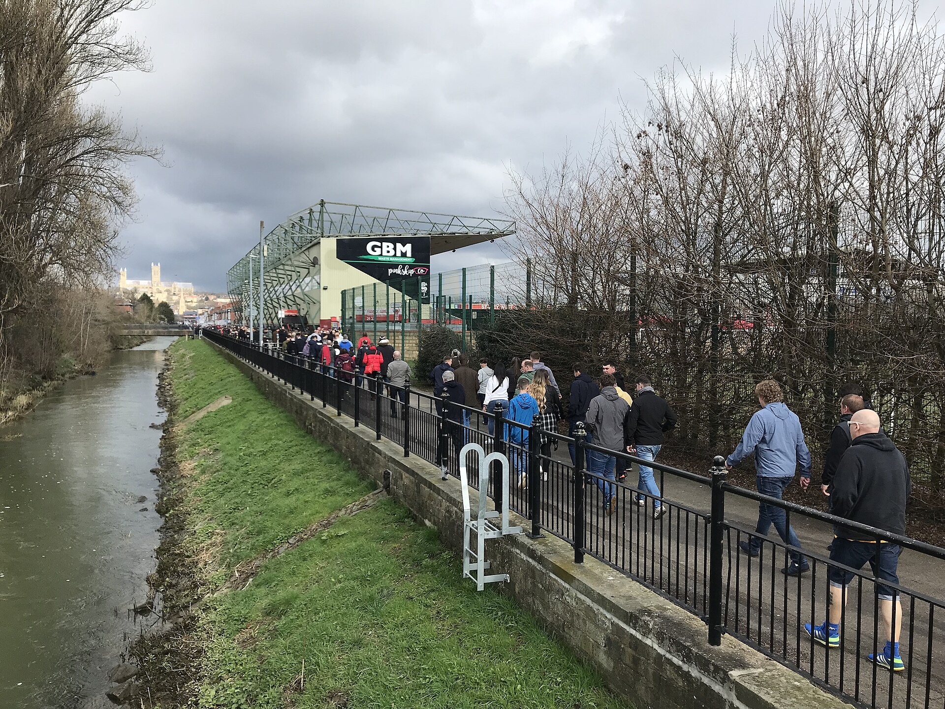 Football supporters heading to the Lincoln City v Peterborough United match on 18 March 2023 - geograph.org.uk - 7434878.jpg · Richard Humphrey · CC BY-SA 2.0